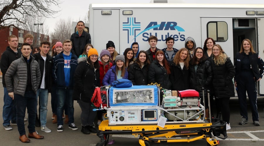 Students stand in front of ambulance at St. Luke's Hospital