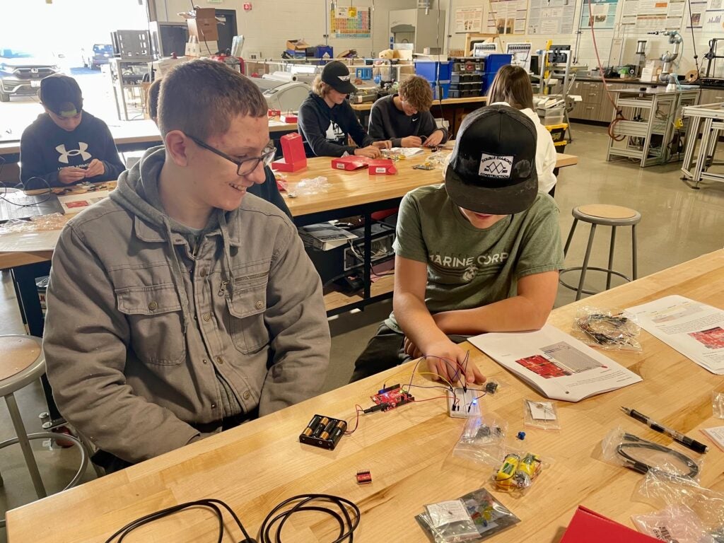two students work to build a semiconductor