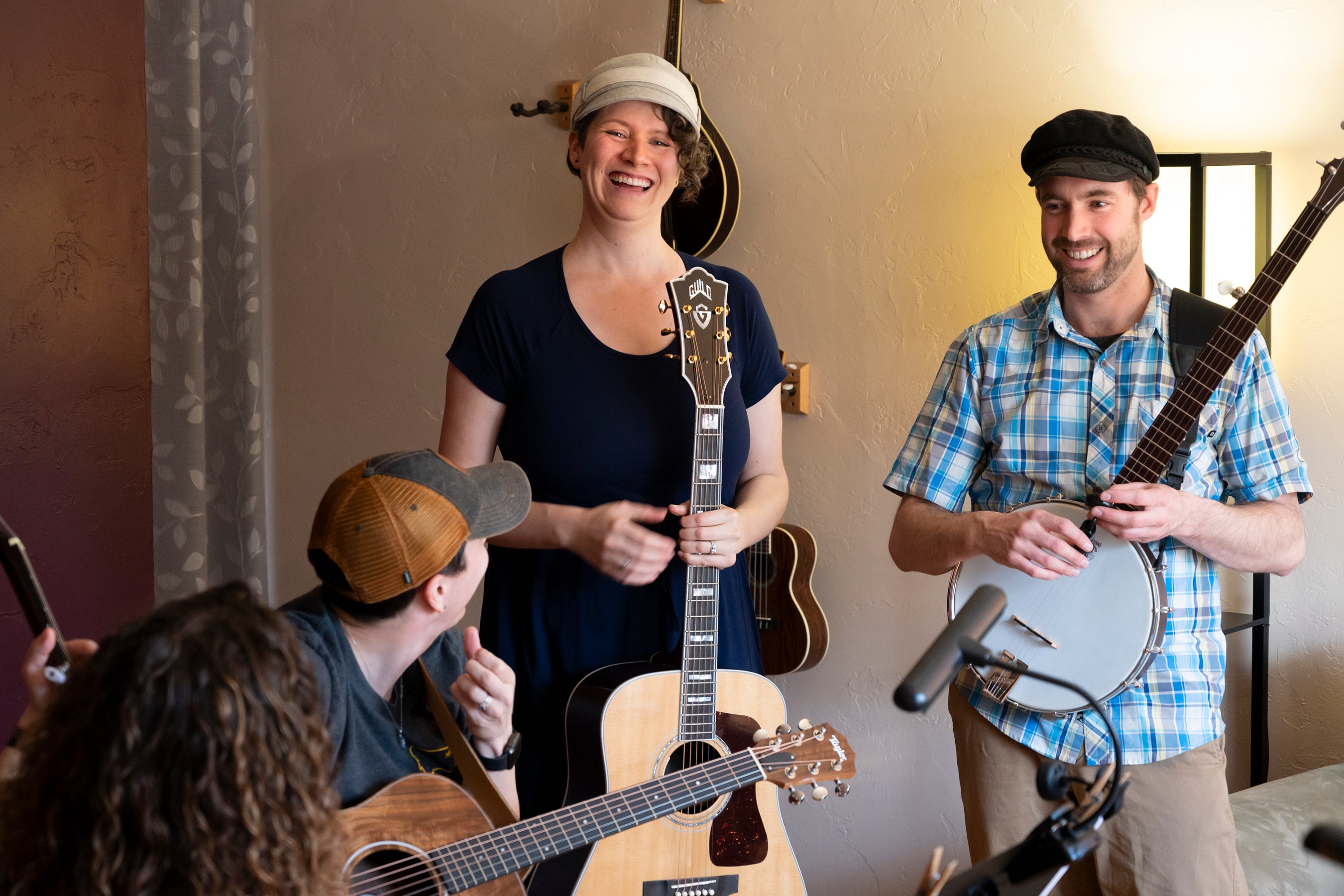 People smiling and laughing while holding their instruments