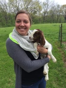 Victoria Volk holding baby goat