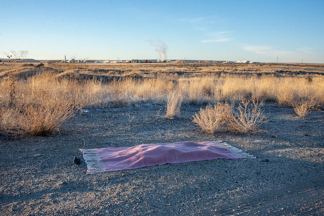 Lily Lee's work, a woven shroud in a desert landscape. 