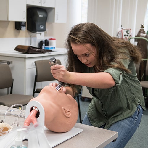 Student practicing a respiratory procedure