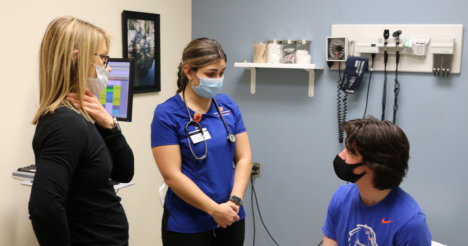 Julee Huesby, Health Services nurse, supervises nursing student Natalie Cacchillo while interacting with patient