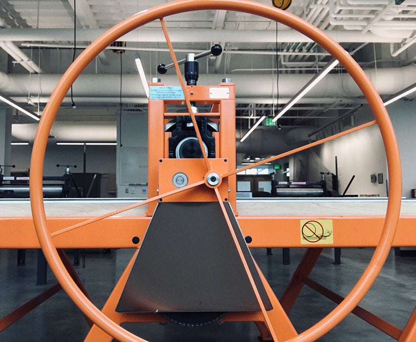 Orange colored printmaking press