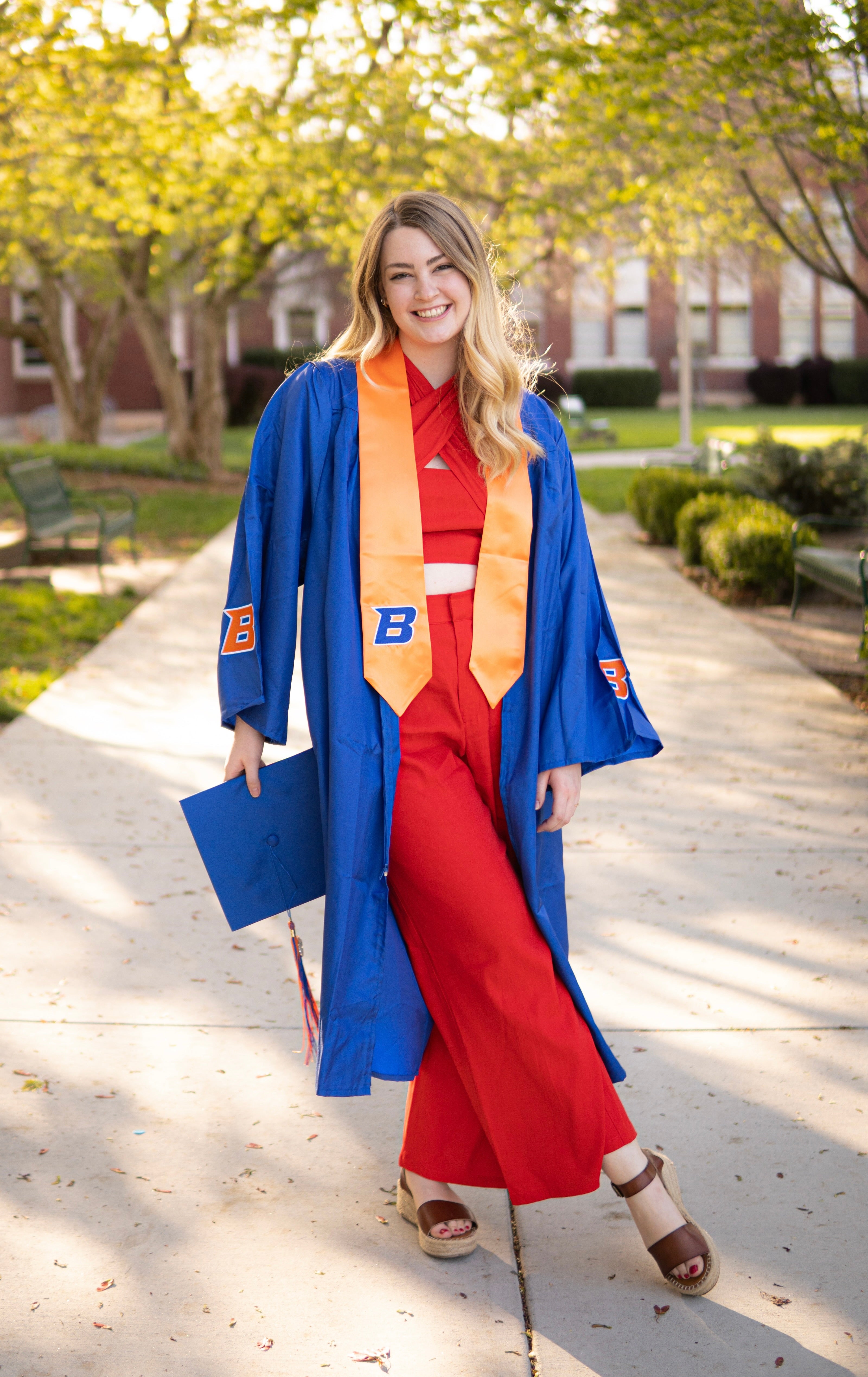 Grace Hall poses in her cap and gown