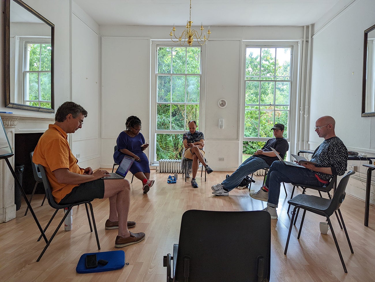 This photo shows Mac Test and actors rehearsing the play in London in the summer of 2022