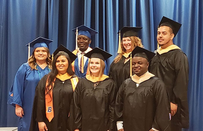 2019 Graduates of the Title IV-E Scholars Program in undergraduate and graduate regalia