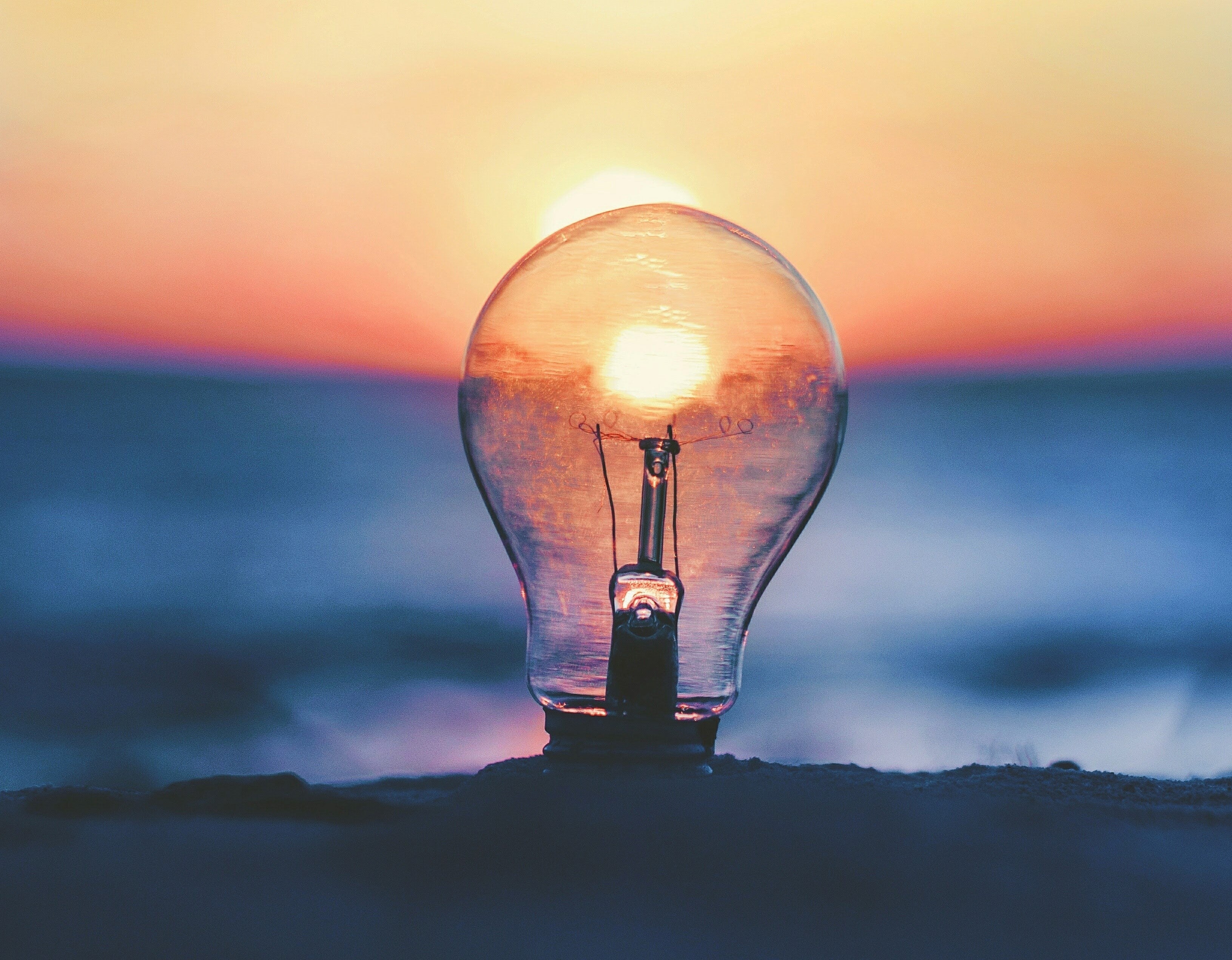 lightbulb with sunset in background