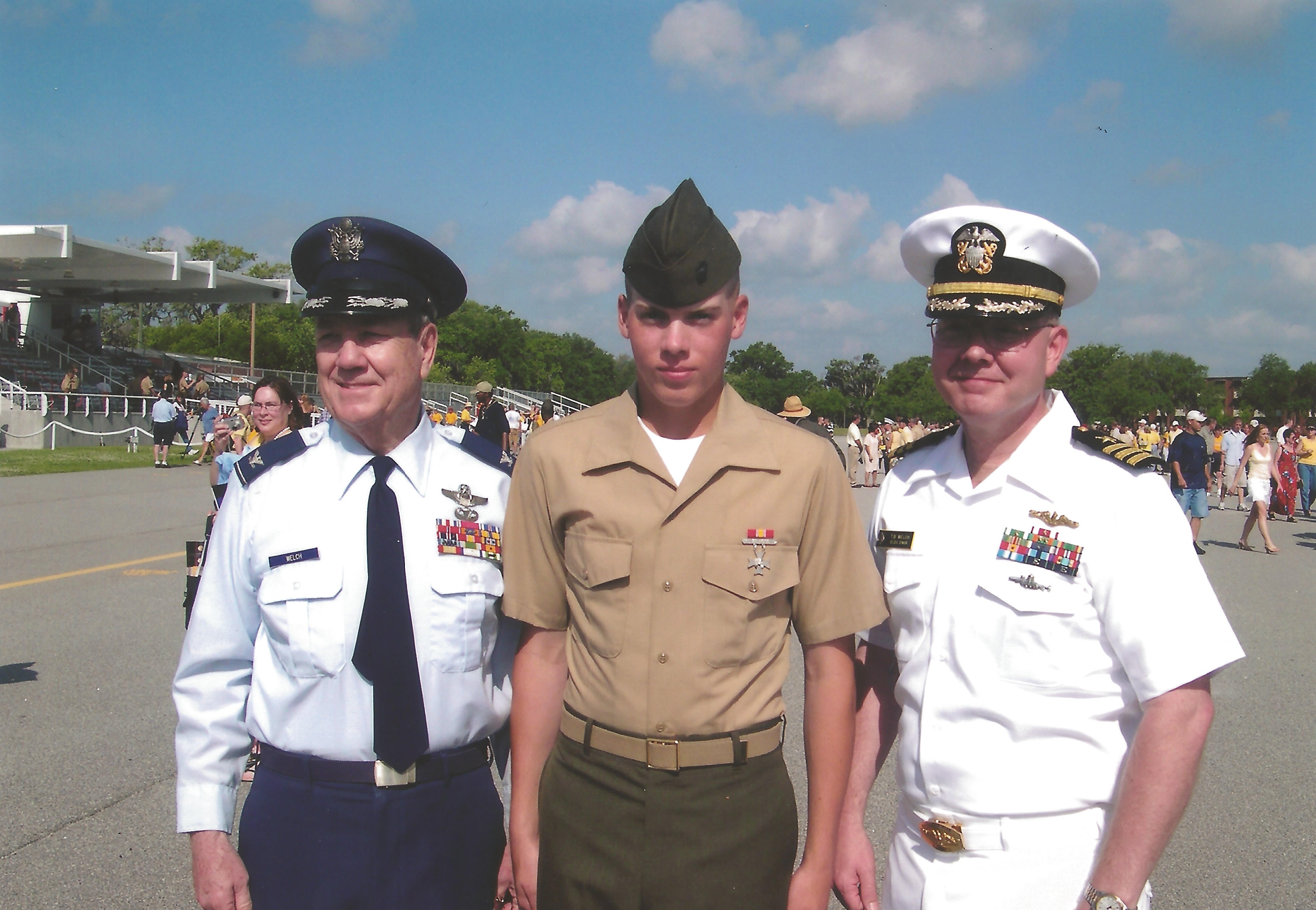 Three generations of Welch service members stand together in uniform.