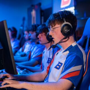 Esports athletes on computers.