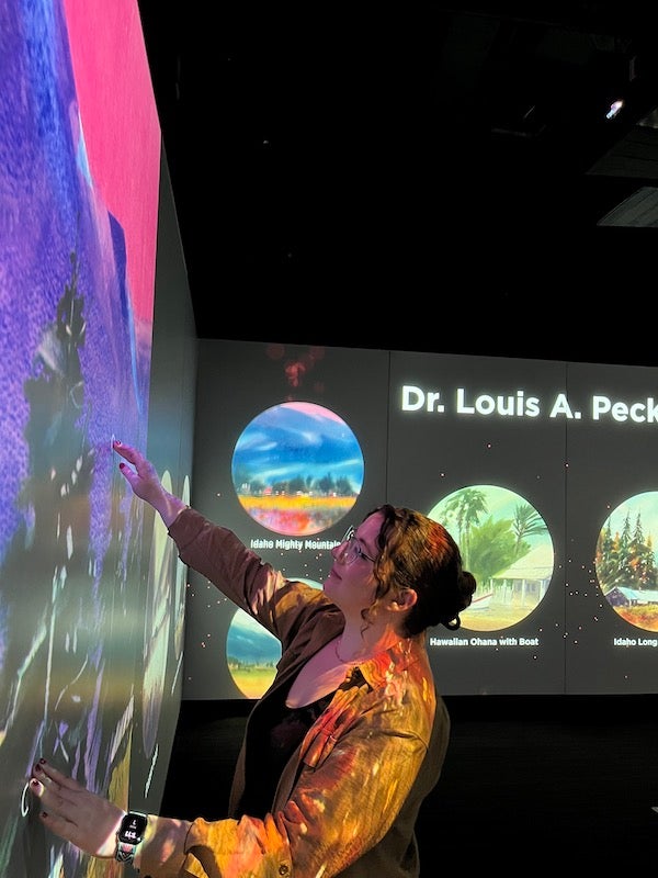 Madison Miller works on curating the exhibit