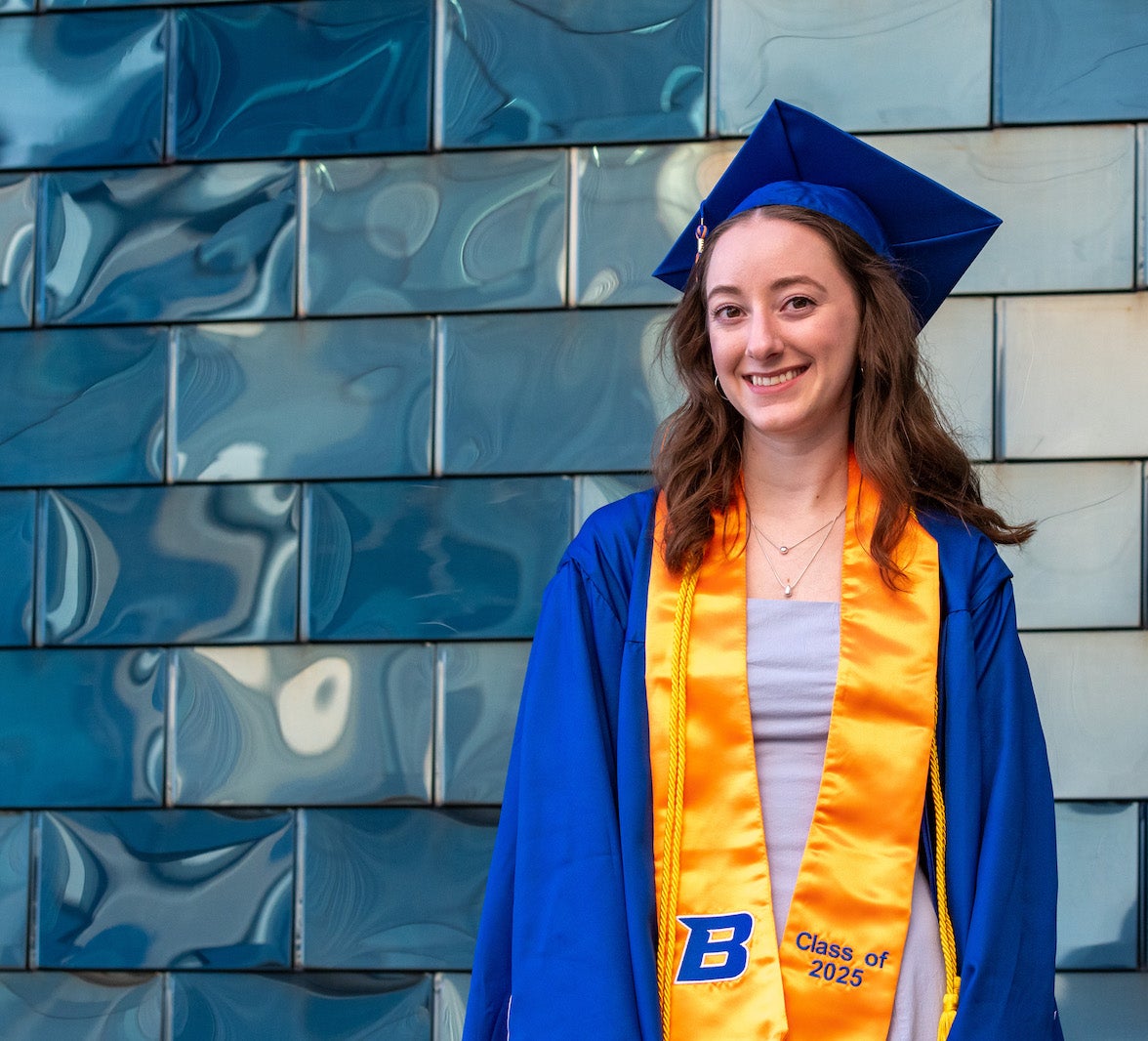 A grad in regalia, Michaela.