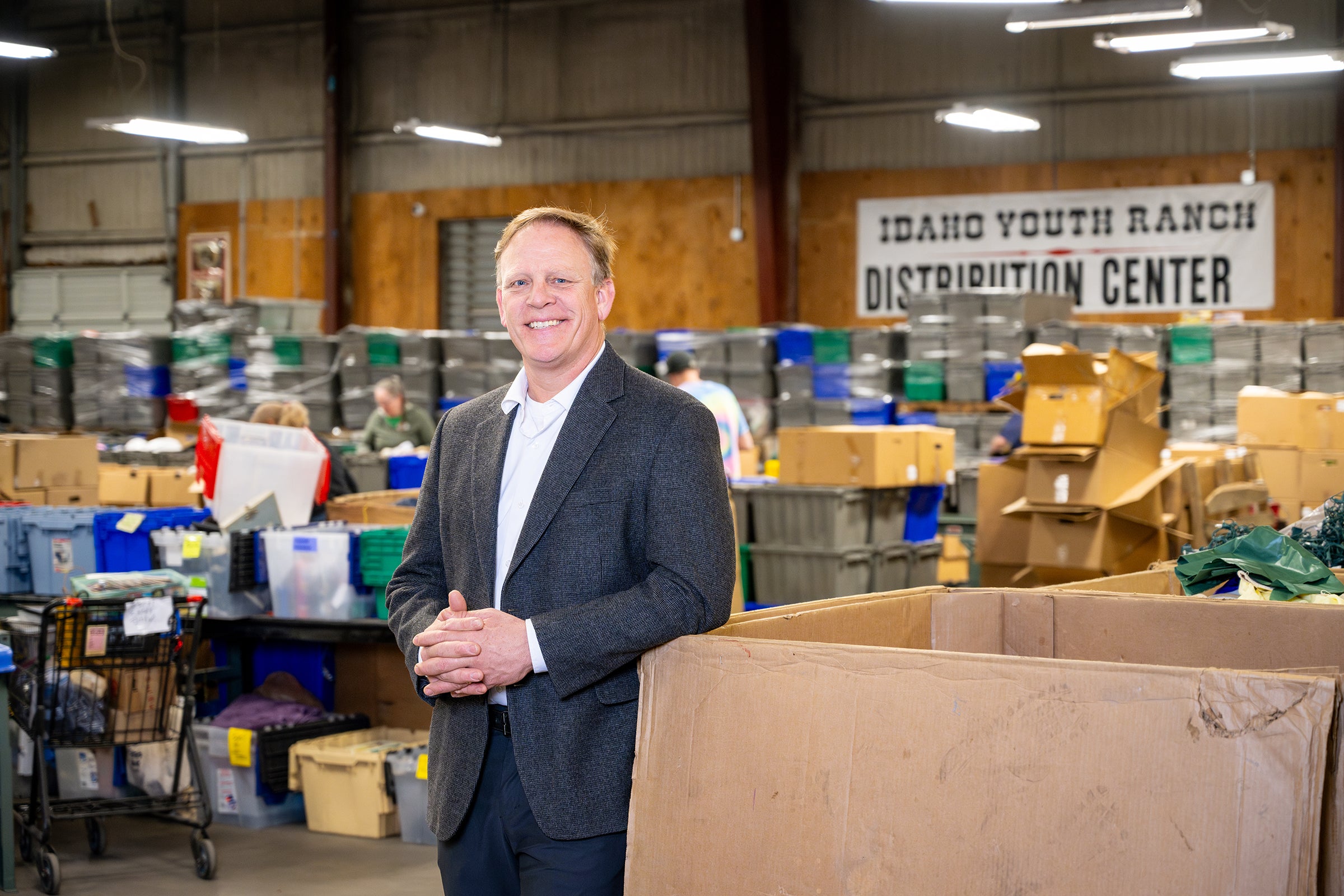 Scott Curtis posing at Idaho Youth Ranch distribution center