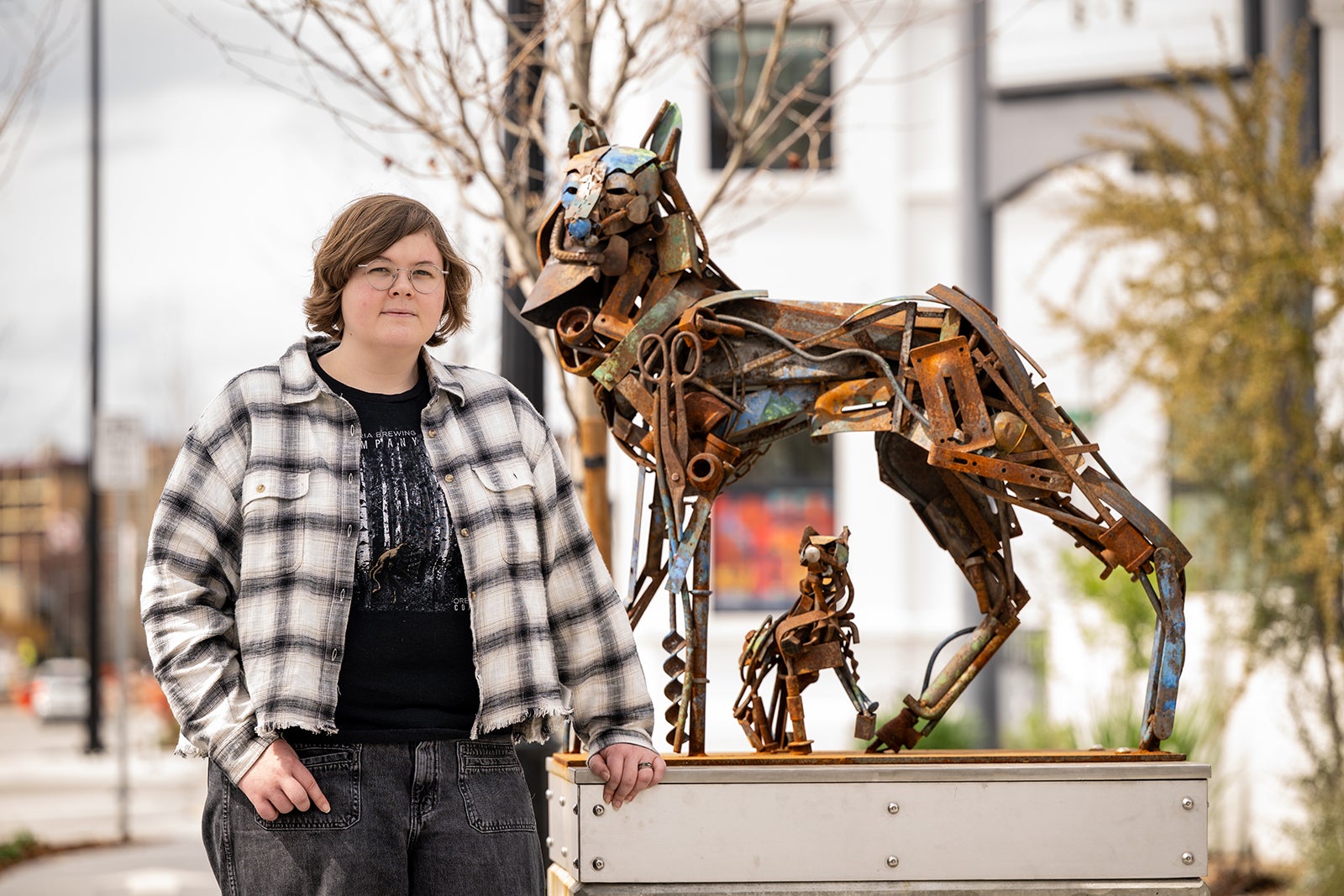 Serena Allen-Szatkowski posing with sculpture