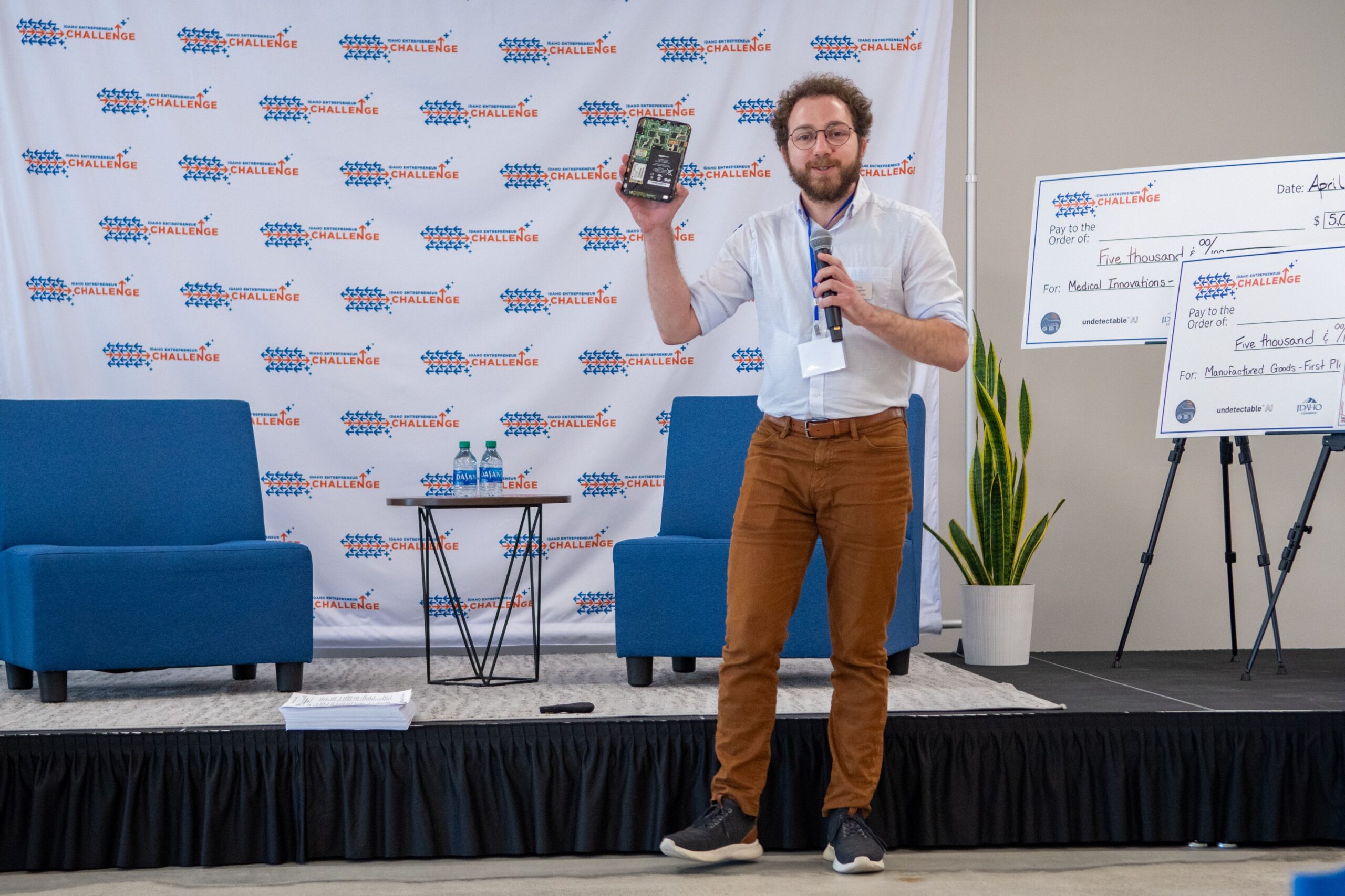 A person speaks at a pitch competition