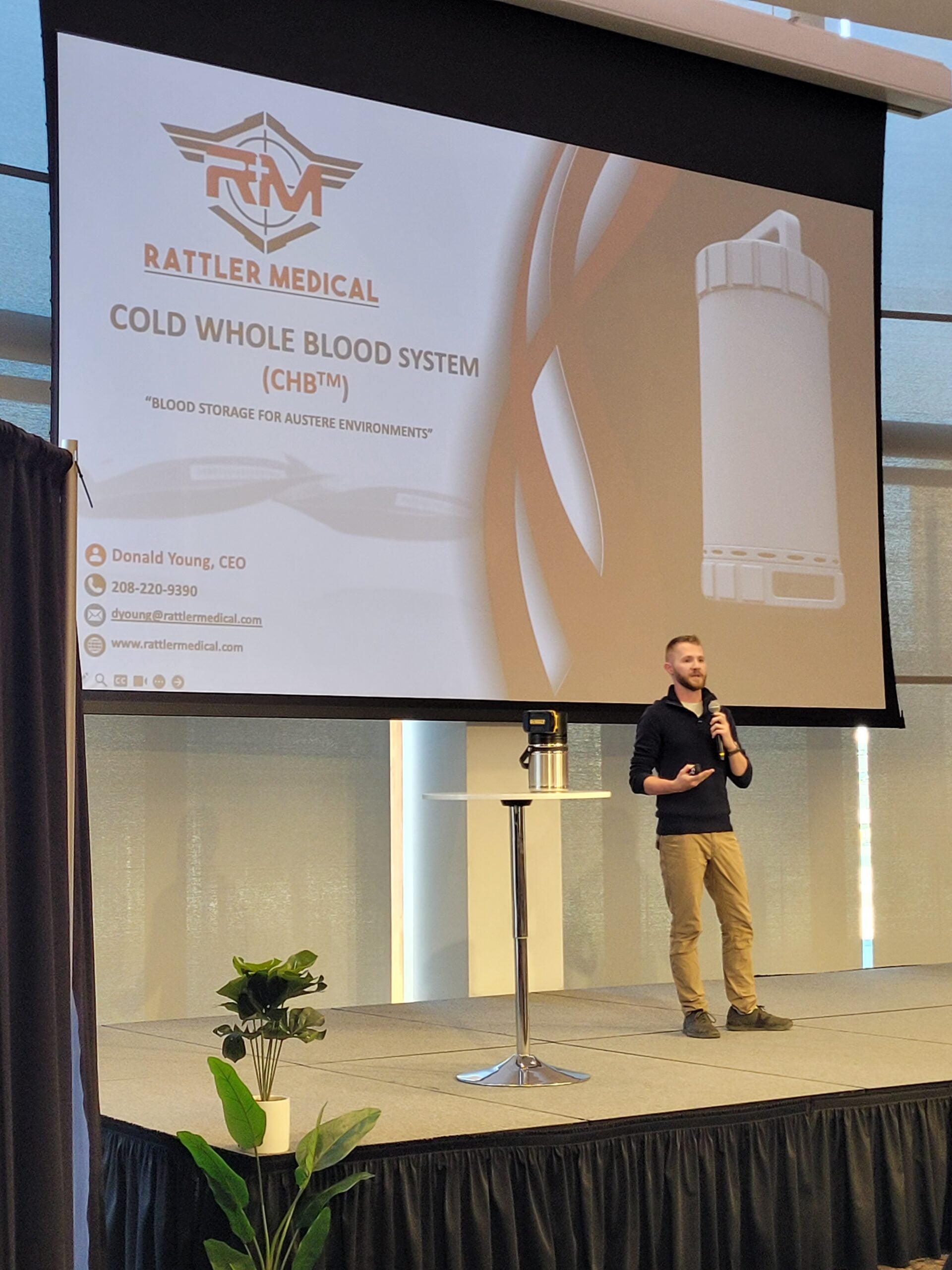 Donald Young pitches the Rattler Medical Cold Whole Blood System, pictured on a projector behind him.