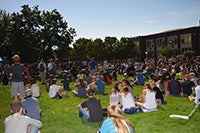 Image of people sitting on the grass