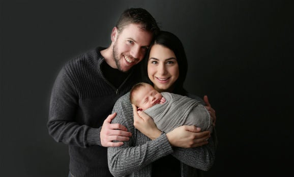 Morgan Prince with her husband and child 