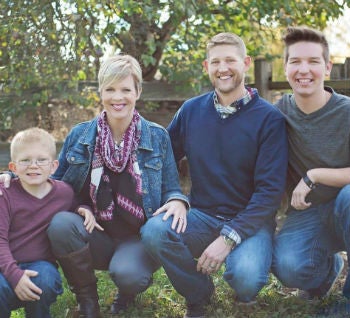 Suzanna Johnson pictured with her husband and sons 