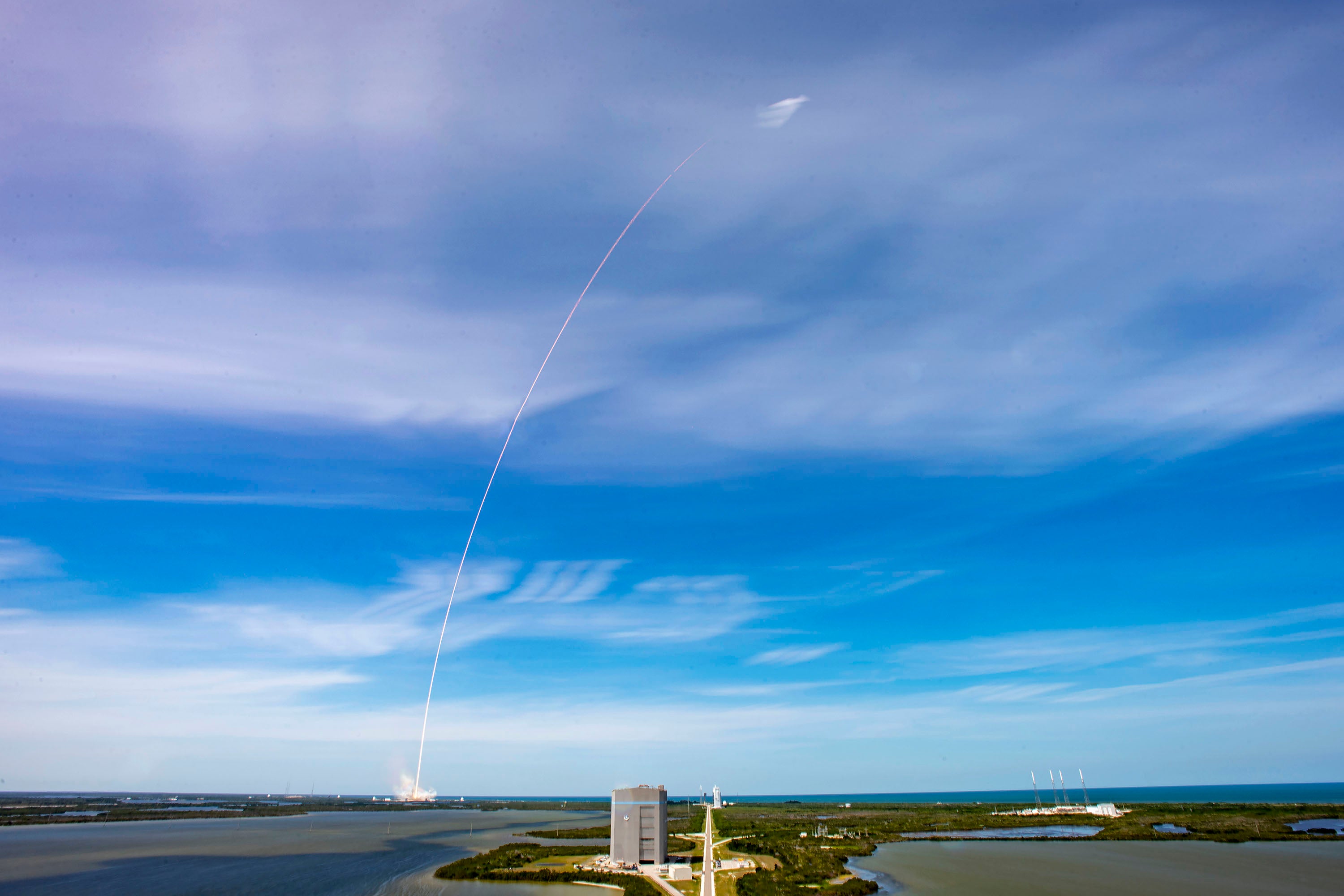 Rocket launch against a blue sky
