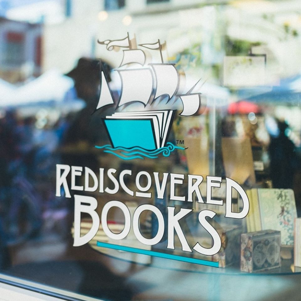 Rediscovered Books logo on a window