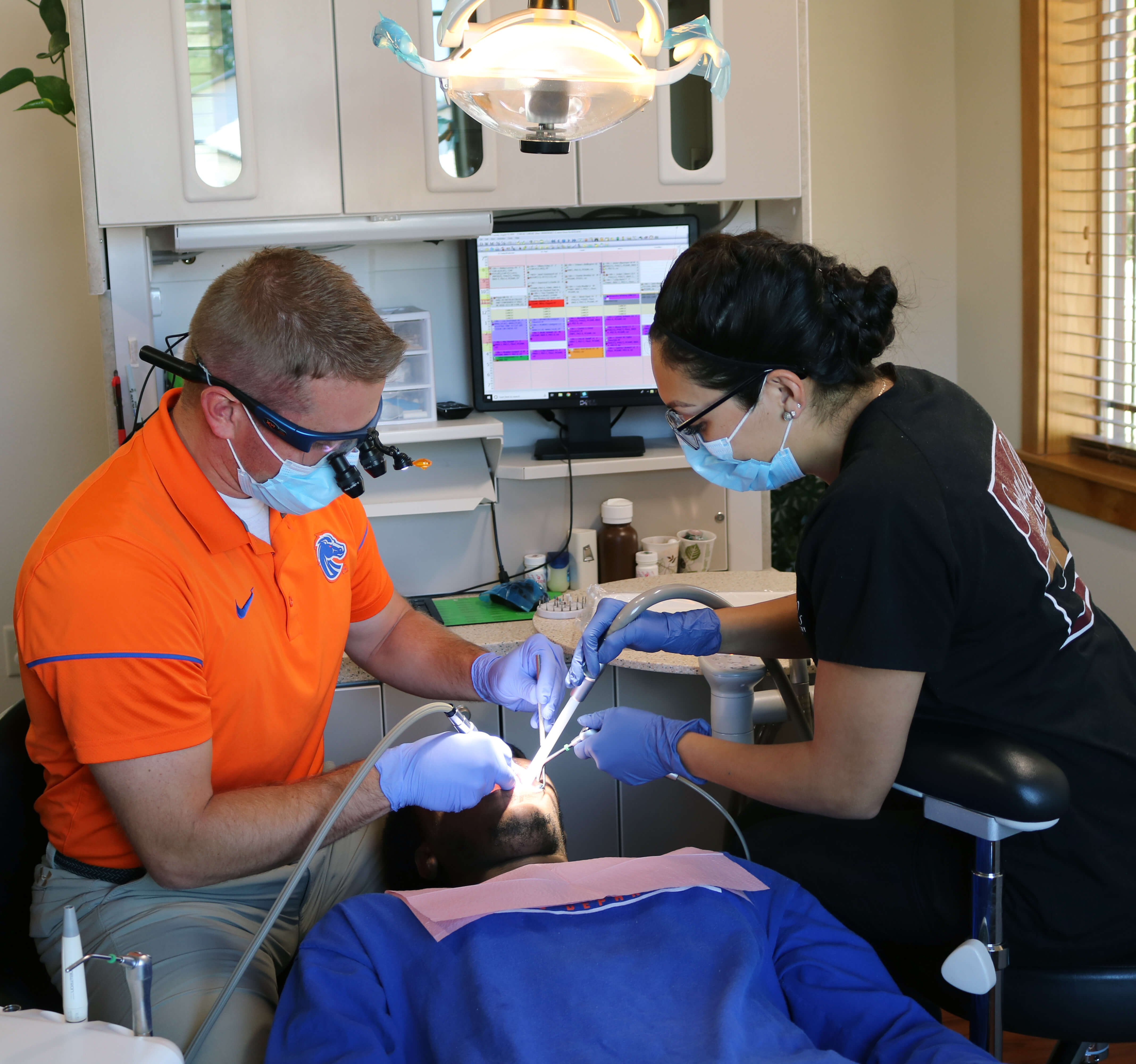dentist and dental assistant
