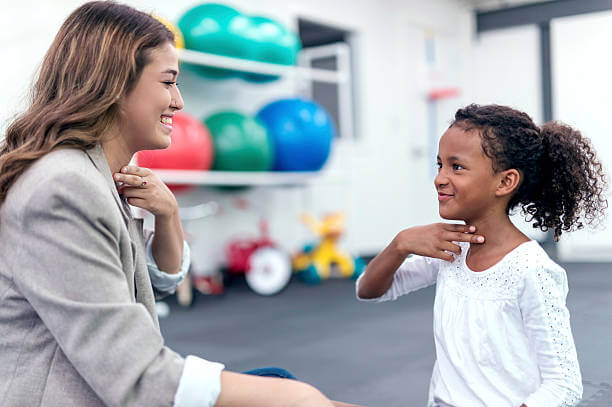 speech therapist working with a patient