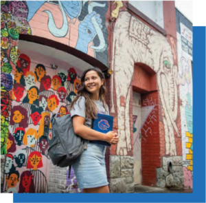 student walks past colorful mural
