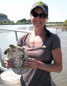 Hanauska-Brown holding turtle
