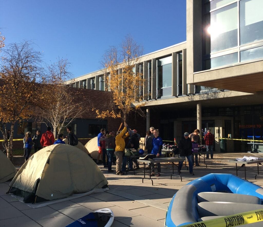 Customers shop for used outdoor equipment at the annual Outdoor Rental Center Used Gear Sale.