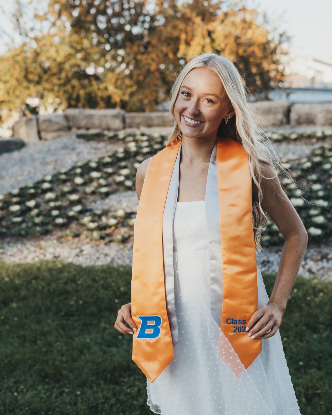 Erin posing with graduation stole