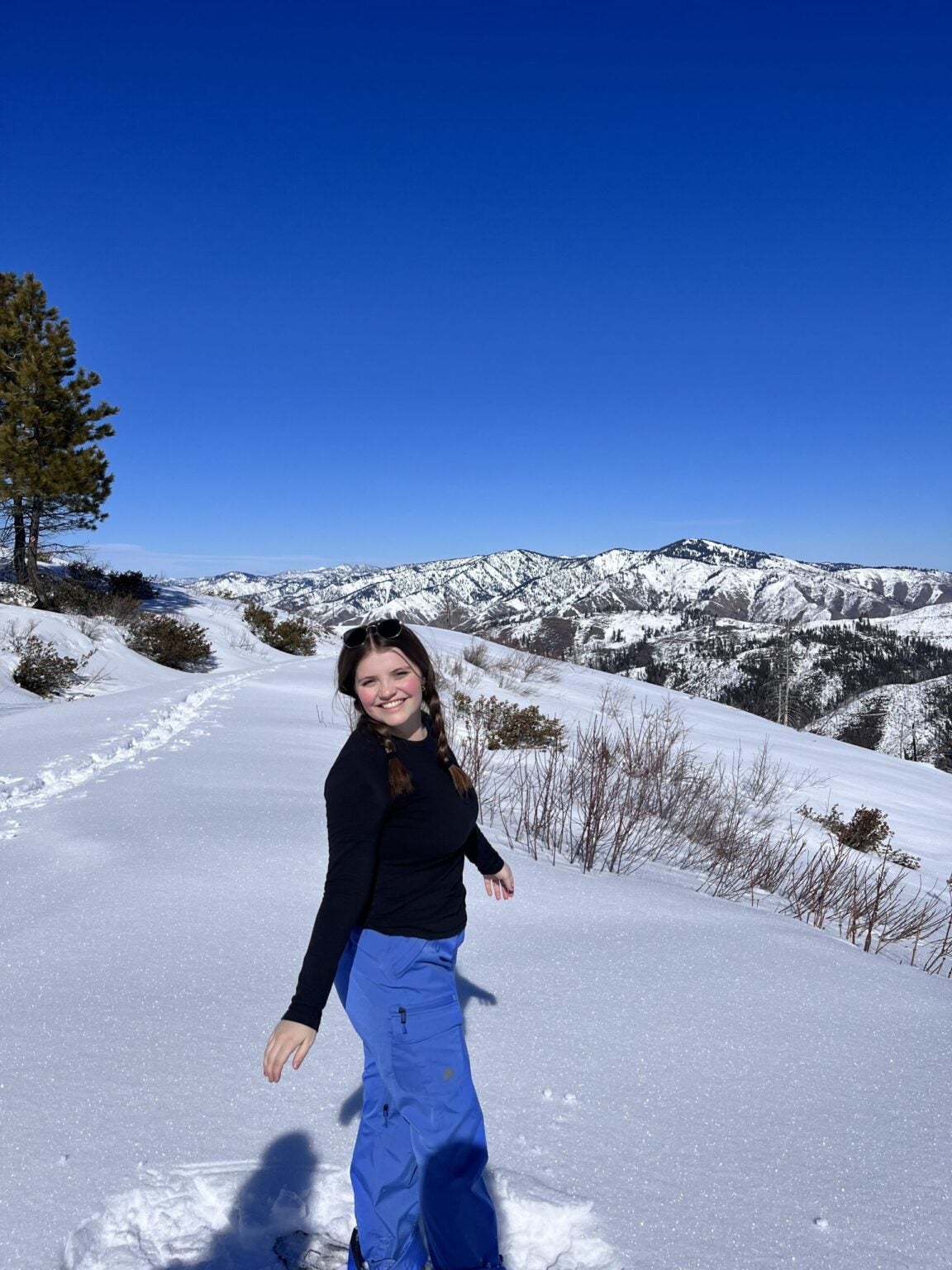 Mae posing in snow covered hill