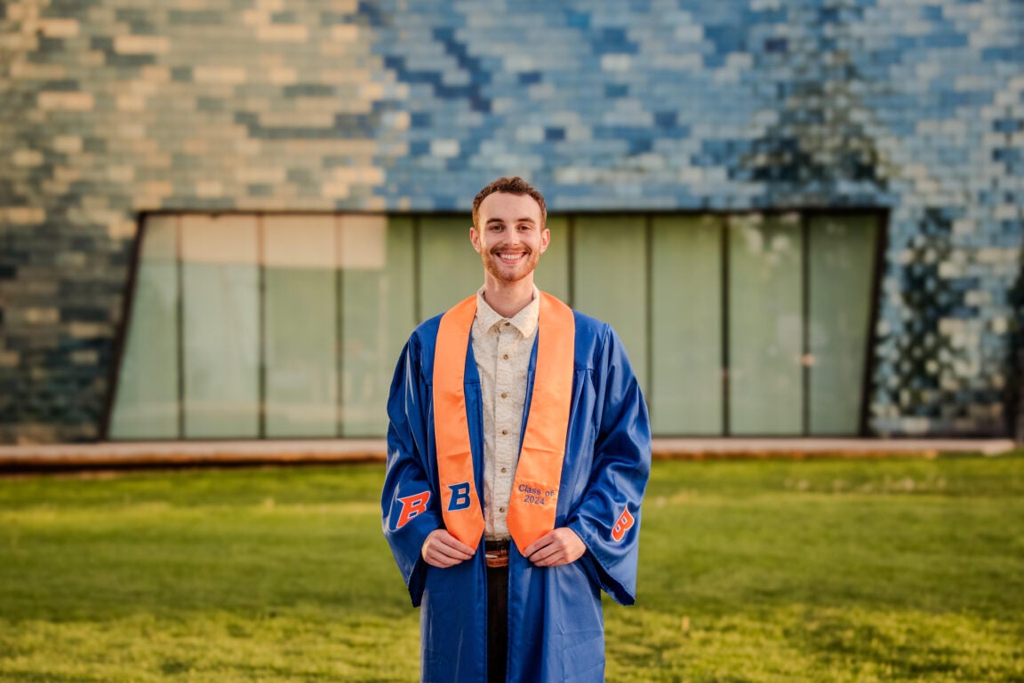 Alex Iturriria on a graduation gown