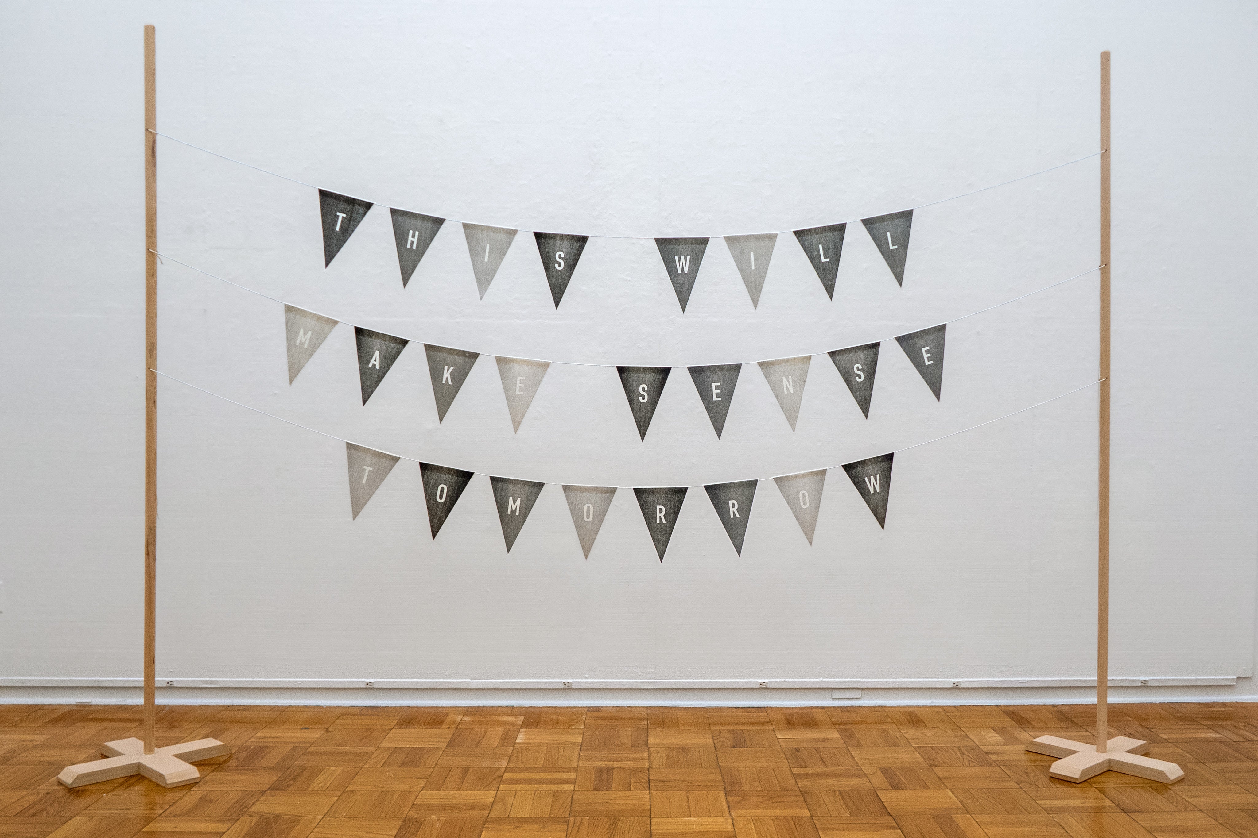 Artwork of a hanging banner that reads, "this will make sense tomorrow."
