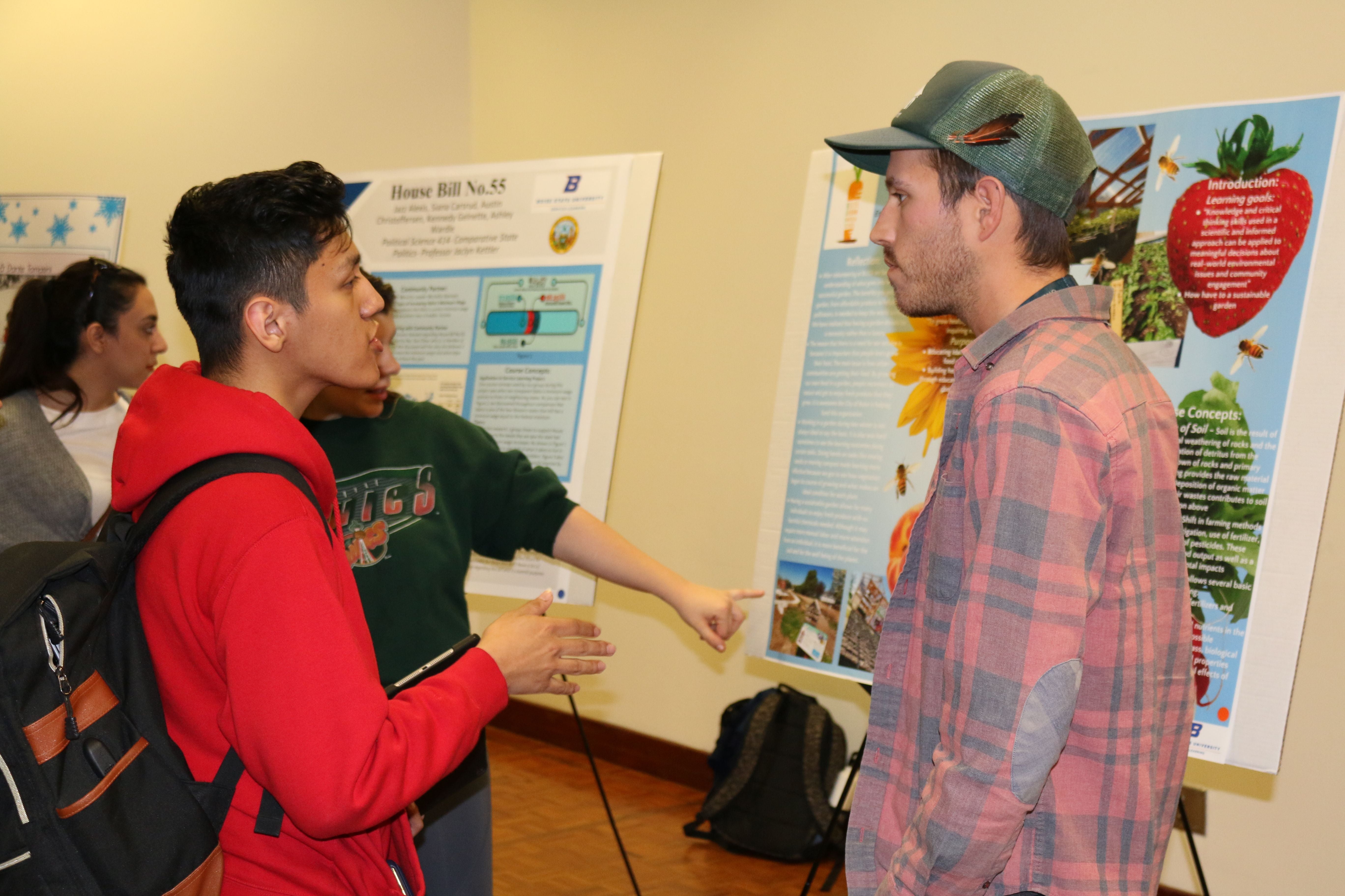 Students interacting at the Spring 2019 Service-Learning Student Poster Exhibition