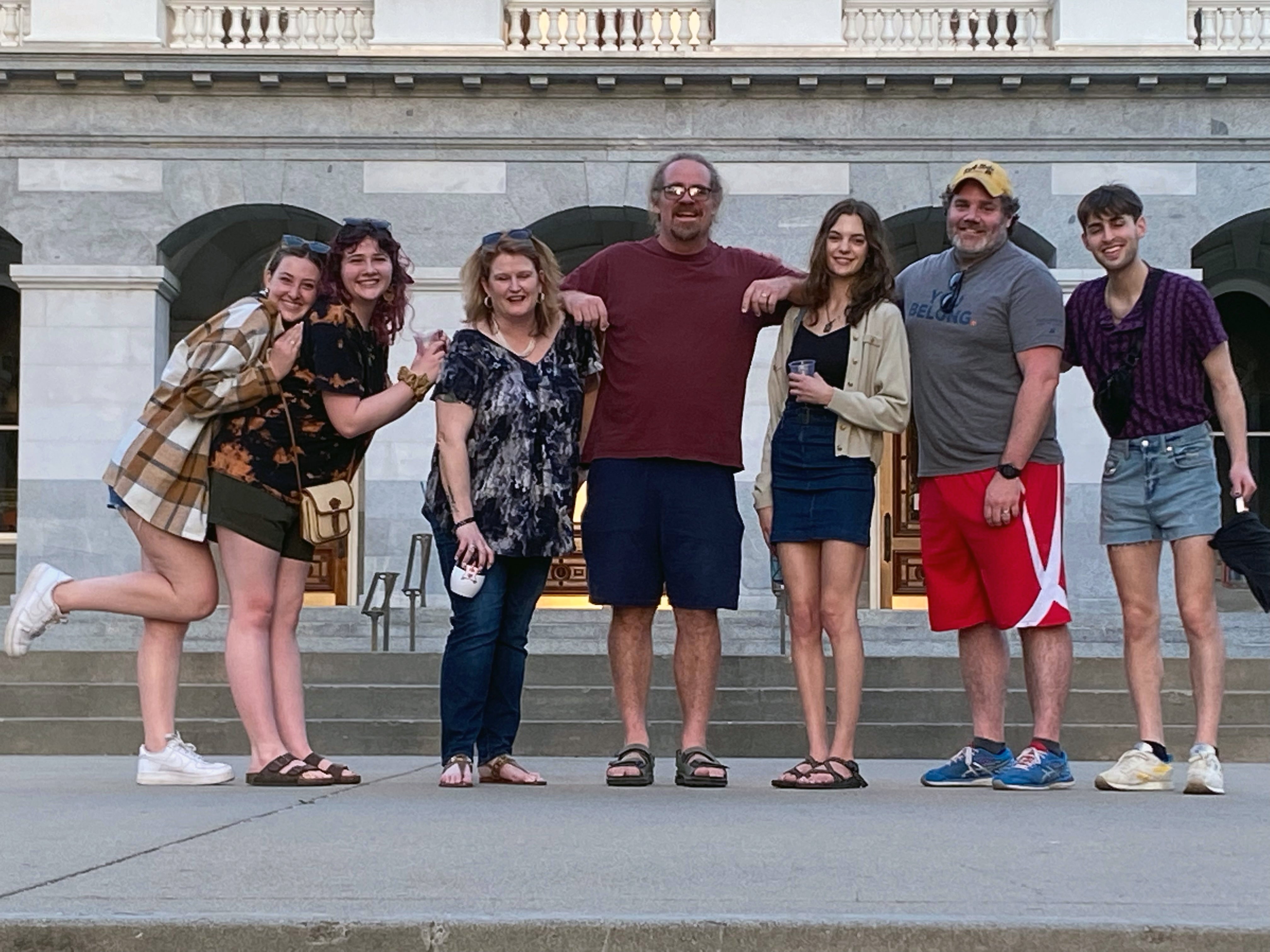 Michael Kreiter and Arthur Scarritt posing with their 5 students outside 