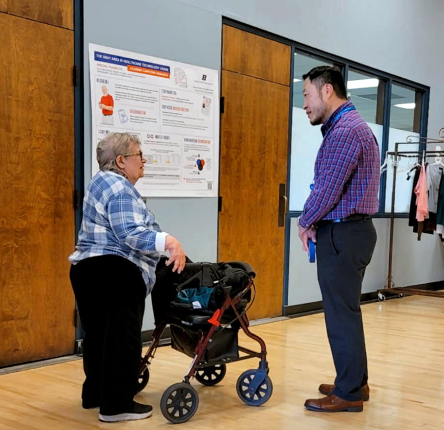 Ron Schmaltz meets with a community member for his research project.