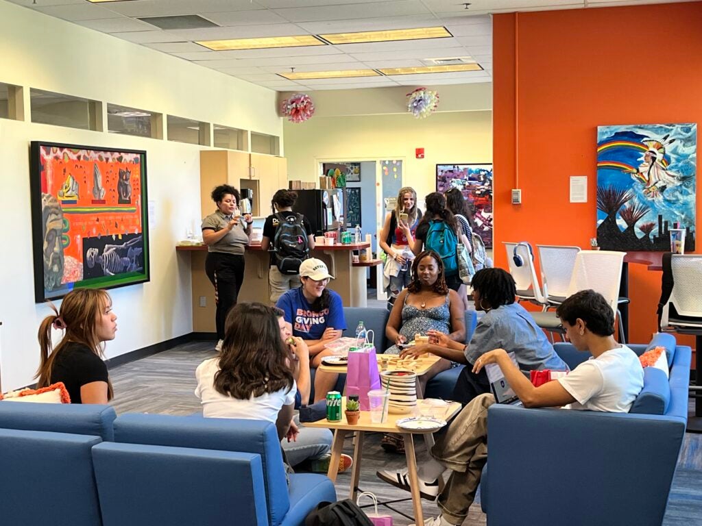 A image of a group of orientation leaders together in the Student Connections and Support Center break room.