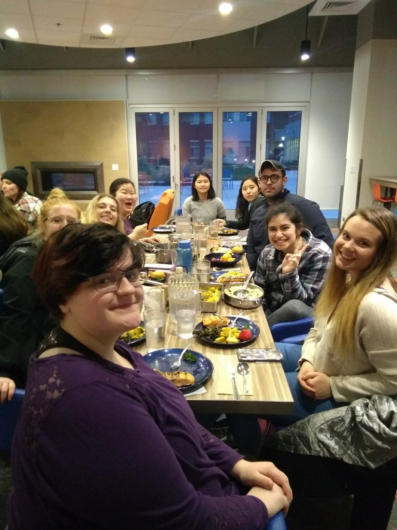 A large group of people dining at a table.