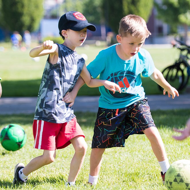 Young campers playing soccer