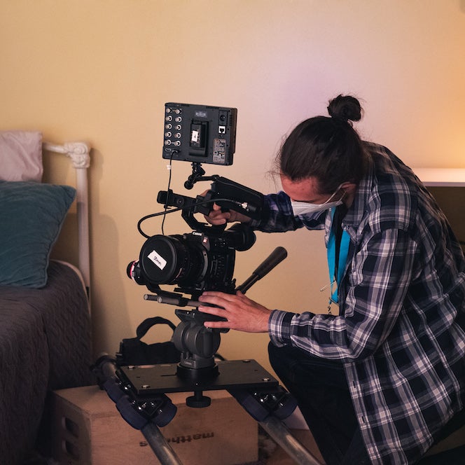 student setting up filming equipment