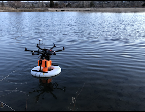 Drone collecting samples from a body of water