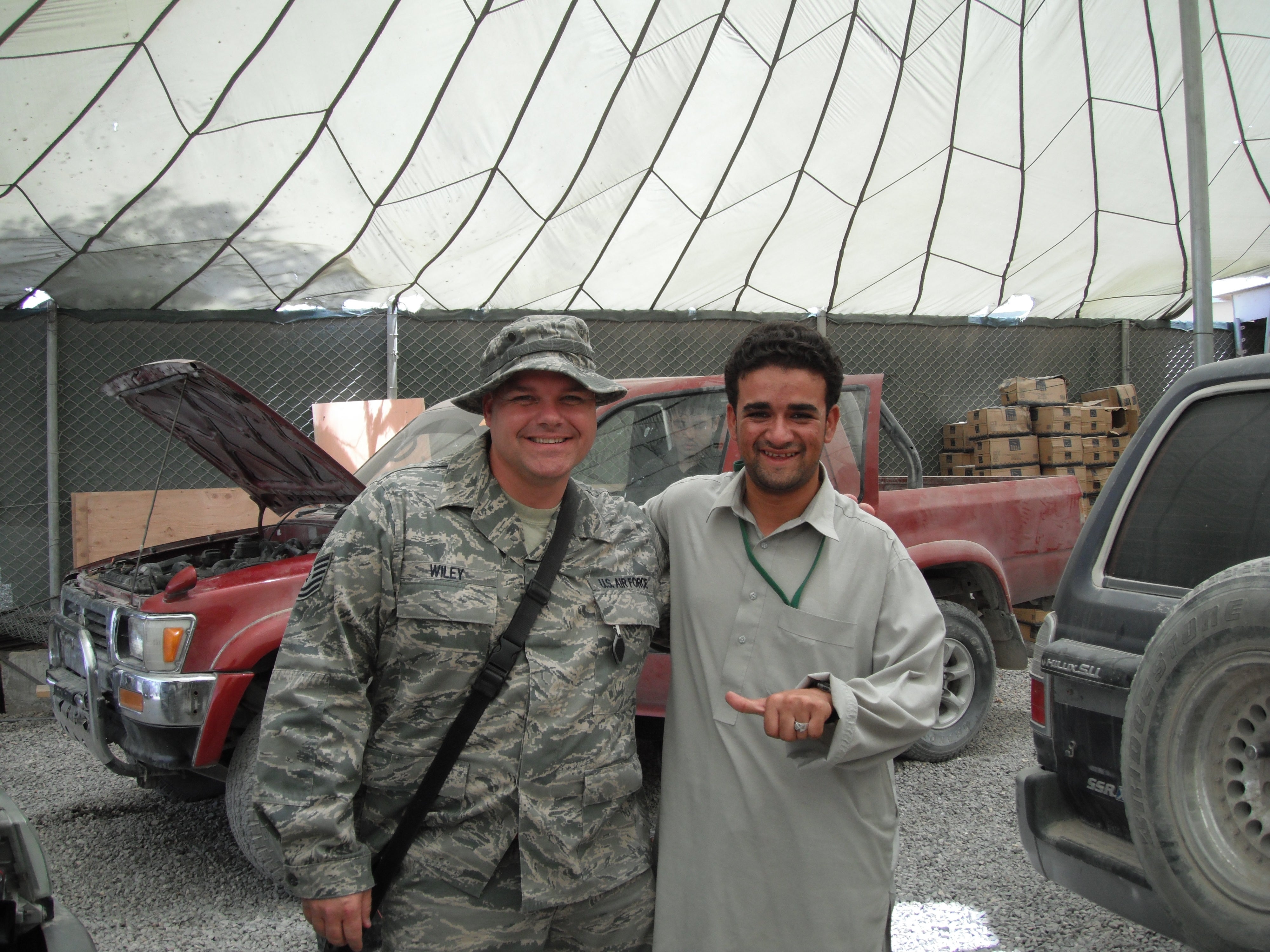 Robert Wiley Jr. (left) alongside a Pakistani car mechanic in Afghanistan.