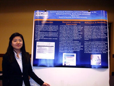 Wenyi Chen with her poster at the Undergraduate Research Conference