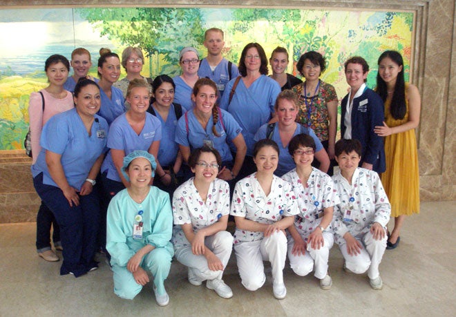 Group photo of Boise State students and faculty with new friends and colleagues at Hangzhou Normal University in China