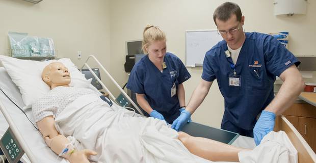 Students practice on simulation center manikin