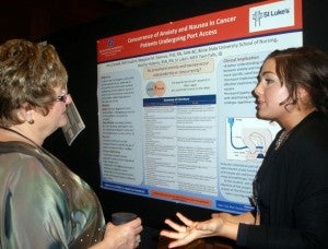 Alia Crandall speaks about her research poster