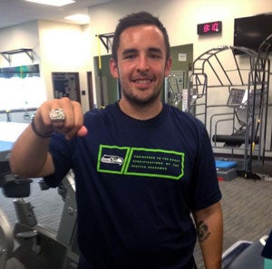 Rey Valdez wearing his internship supervisor's Superbowl ring