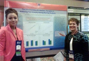 Alia Crandall and Marty Downey with research poster