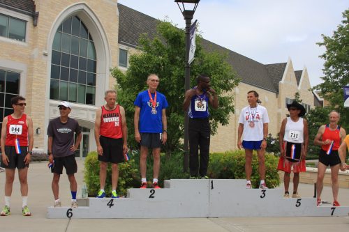 Hoeger, third from right, on the medals stand.